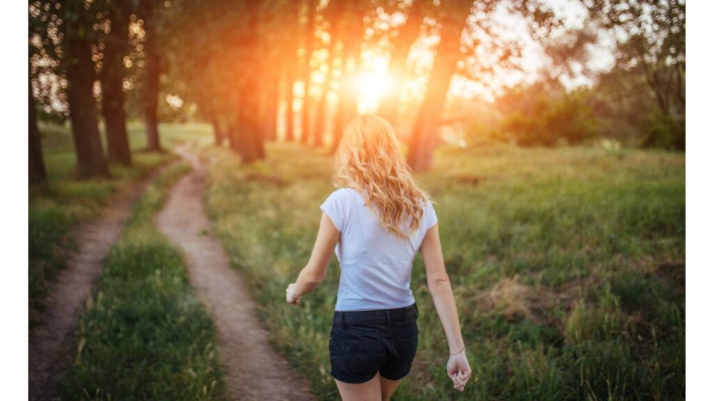 Image of a girl walking by Canva. 
Tips for sustainable living while travelling - Walk  #sustainableliving #ecofriendlylivingtips #sustainablewaystolive #sustainabletips #wecareearth 