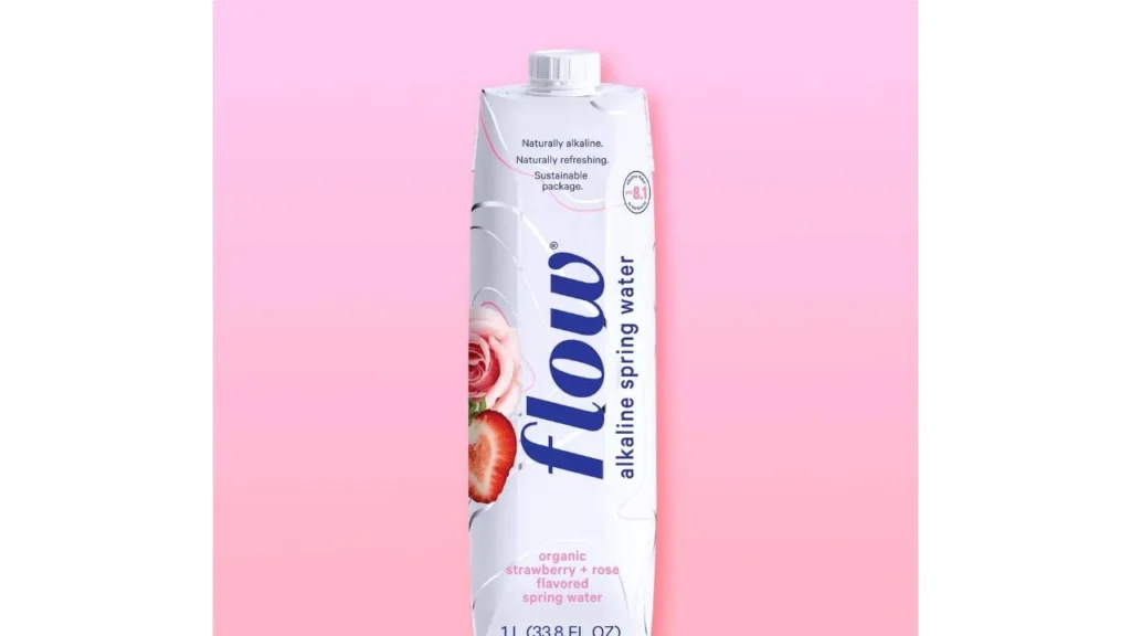 A bottle of flow alkaline spring water. The upper label highlights Naturally alkaline, Naturally refreshing, Sustainable Package. At the bottom label organic strawberry+rose flavoured spring water. 