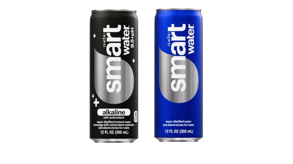 A bottle of smartwater 9.5+pH. The label highlights alkaline with antioxidants. Vapor distilled ionized water beverage with antioxidants selenium and electrolytes. 12 FL OZ (355mL) 

The blue water bottle label highlights vapor distilled water and electrolytes for taste. 12 FL OZ (355mL)