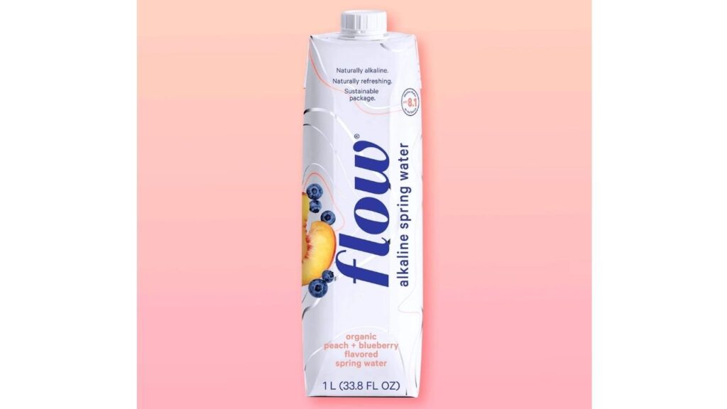 A bottle of flow alkaline spring water. The upper label highlights Naturally alkaline, Naturally refreshing, Sustainable Package. At the bottom label organic strawberry+rose flavoured spring water. 